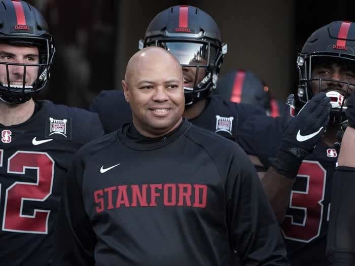 Stanford football head coach David Shaw stepped up to mop the floor after a basketball game