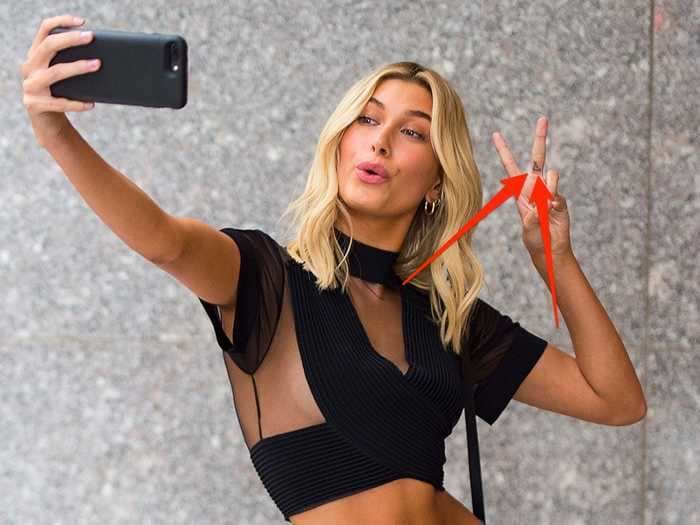 Hailey Baldwin says she regrets getting a tattoo of a handgun when she was 18