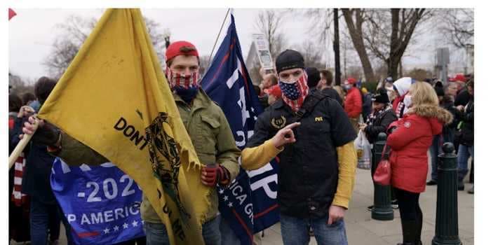 2 brothers were charged over the Capitol Riot. One yelled a Proud Boys slogan as he broke in, prosecutors say.