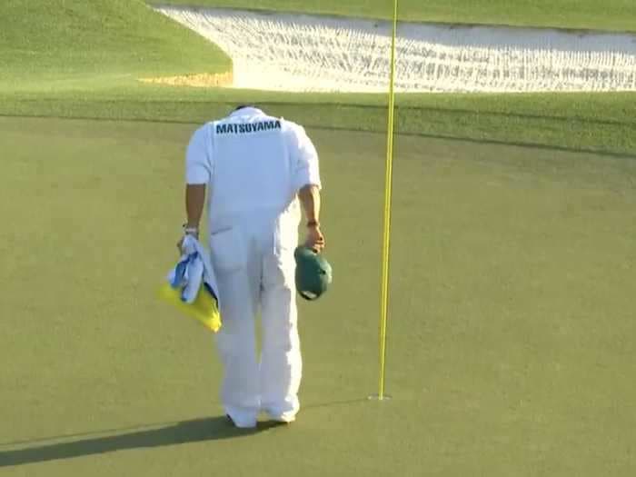 The caddie for Masters champ Hideki Matsuyama bowed in respect to Augusta National moments after winning