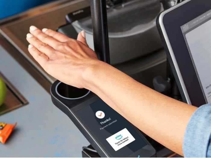 Amazon installed hand scanners in Whole Foods stores that lets shoppers pay with a palm print. Here's how they work.