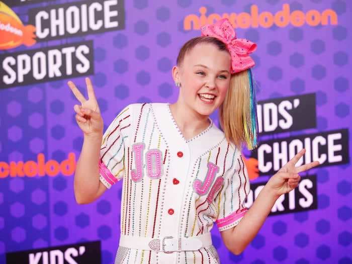 JoJo Siwa shared photos of a Disney World vacation she took with her girlfriend that included cuddling on rides and wearing matching outfits