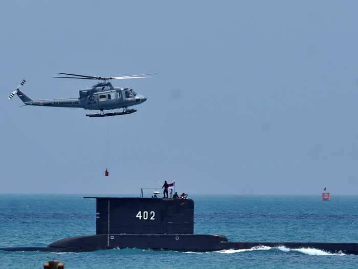 Hopes of rescuing 53 sailors fade as missing submarine now believed to be 'sunk' after debris discovered, Indonesia Navy chief says