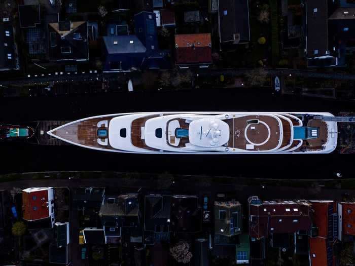 Photos show a 310-foot superyacht navigating through miles of narrow Dutch canals to get from a shipyard to the sea
