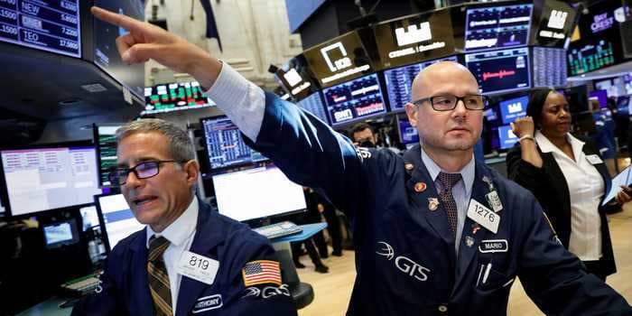 Dow soars 318 points to record high as investors weigh new economic-recovery data