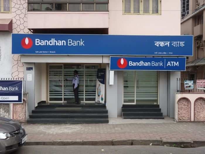 Bandhan Bank falls 4% after reporting an 80% fall in its net profit – positive market trends help it bounce back into the green