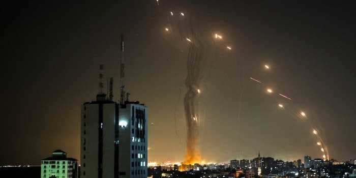 Video shows Iron Dome interceptors filling the sky as more than 100 rockets rain down on Israel