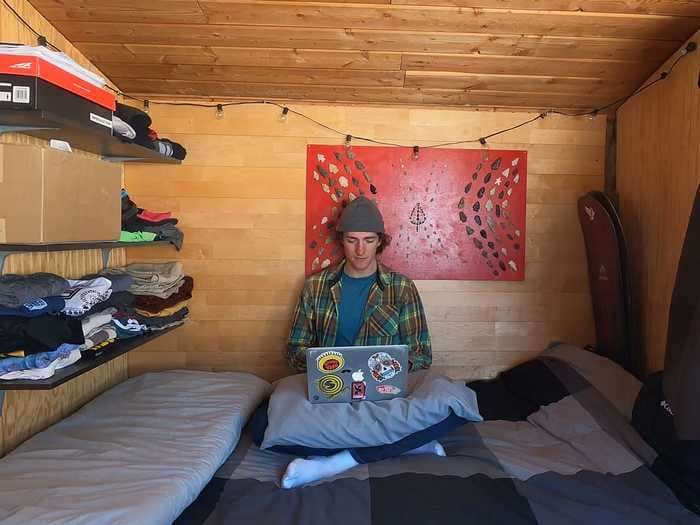 I spent 9 months in a tiny home on my employer's property with just enough room for my bed and snowboards - here's what it was like