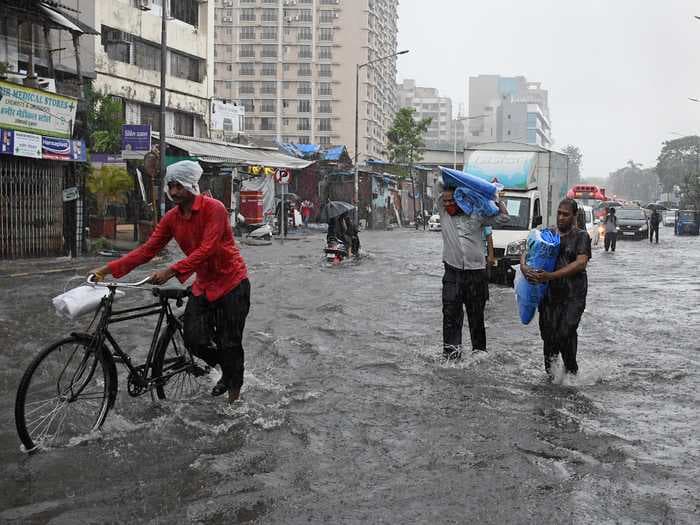 A cyclone in India's western states has complicated efforts to slow down the COVID-19 spread as cases surpass 25 million