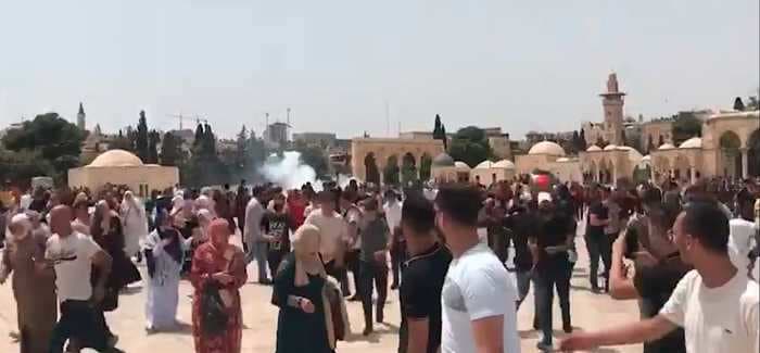 Video appears to show new violence at the Al-Aqsa Mosque in east Jerusalem on the first day of the Israel-Hamas cease-fire