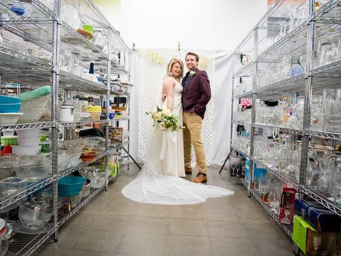 A couple who is thrifting their wedding decor had a stunning photo shoot in a Goodwill store