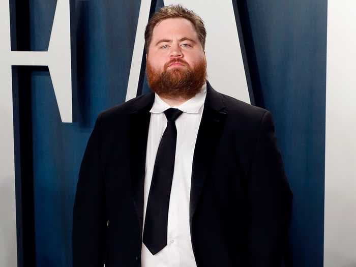 Paul Walter Hauser swings back at 'Cruella' critics who panned the film and dishes on if we'll ever see him on 'Cobra Kai' again
