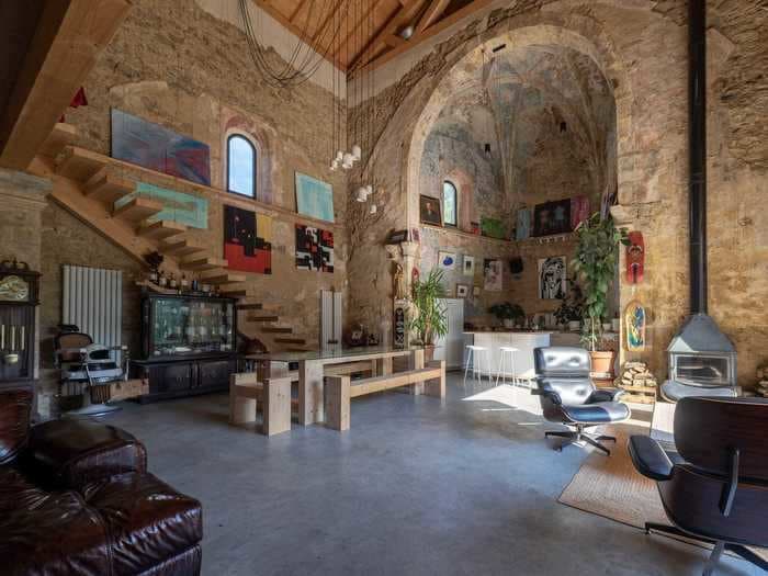 An abandoned 16th-century Spanish church was transformed into a dream home with a 2-story loft and a bedroom in the bell tower