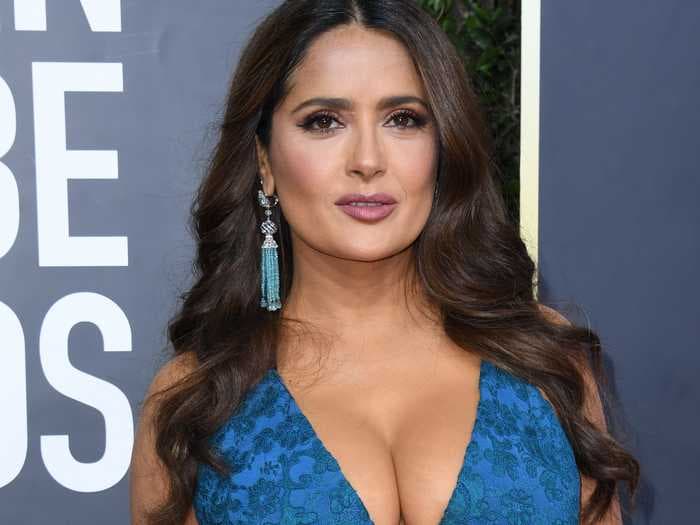 Salma Hayek says that her breasts have naturally gotten bigger during menopause and that they're causing back pain