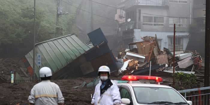 Video shows mud hurtling through a Japanese city during a landslide, leaving at least 20 missing