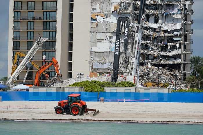 Rescuers searched 3 times for left-behind pets in the still-standing part of the collapsed Florida condo