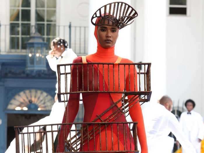 Models walked in a historic fashion show dressed as items by Black inventors, from a hairbrush to a traffic light