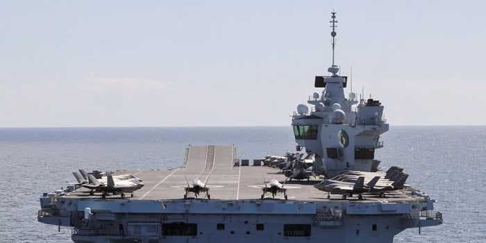 UK's flagship aircraft carrier has an outbreak of around 100 COVID-19 cases on its first deployment