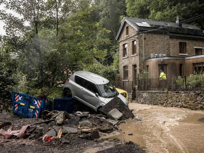 Video captured cars floating down flooded streets in Belgium as heavy rain pummels the region