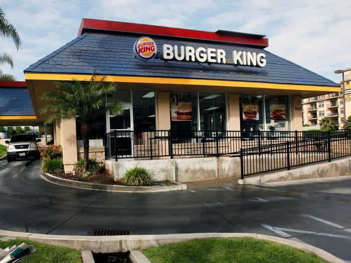 A former Burger King employee who was accused of pointing a gun at customers is due to appear in court, Michigan police say