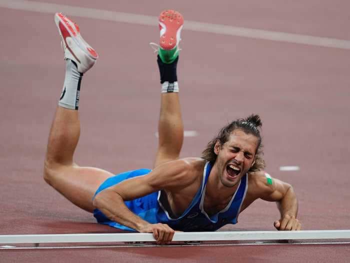 An exuberant high jumper who wore socks with his face agreed to share an Olympic gold medal with his opponent