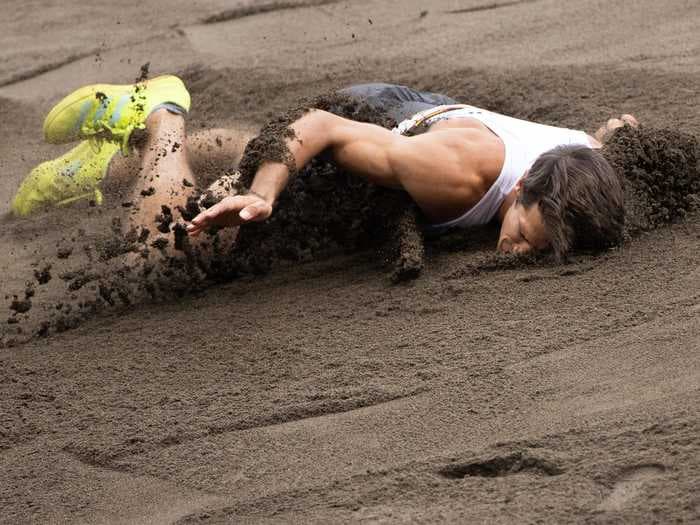 An Olympic decathlete twisted his ankle on the long jump, belly-flopped into the pit, and had to be taken away in a wheelchair