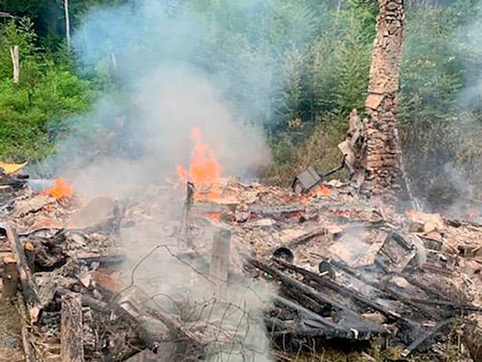 A man went to jail for refusing to leave his cabin of 27 years on someone else's land. Then, it burned down.