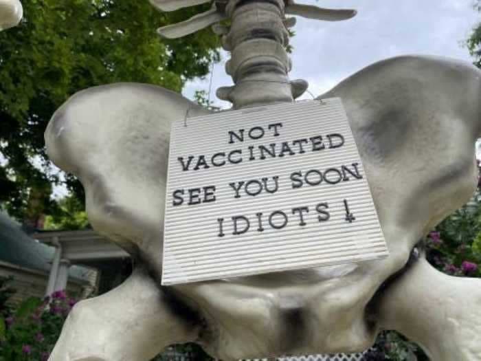 A North Carolina man built a 13-foot skeleton in his front yard warning his unvaccinated neighbors: 'Not vaccinated, see you soon, idiots!'