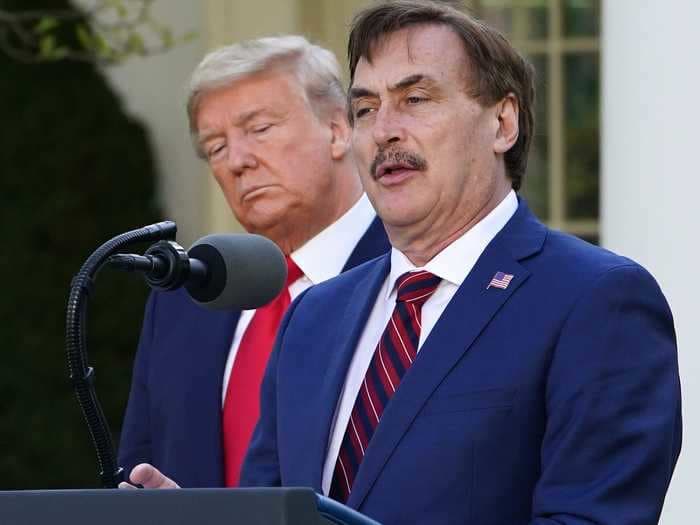 Jair Bolsonaro's son gave Mike Lindell a MAGA hat signed by Trump at event talking about voter fraud