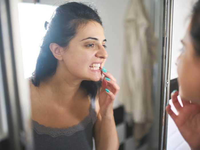 TikTok users are wrapping rubber bands around their teeth to fix their gaps. Dentists say the trend could cost you a tooth.