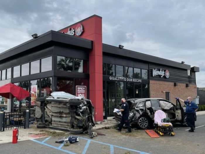 A car drove off a New Jersey highway and crashed into a Wendy's, narrowly missing a family eating outside, police say