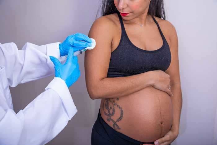 A new study says pregnant people experience few side effects from the COVID-19 vaccine