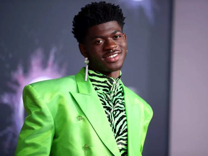 Lil Nas X responds to backlash over his fake pregnancy photos and jokes that the 'negative energy is not good for the baby'