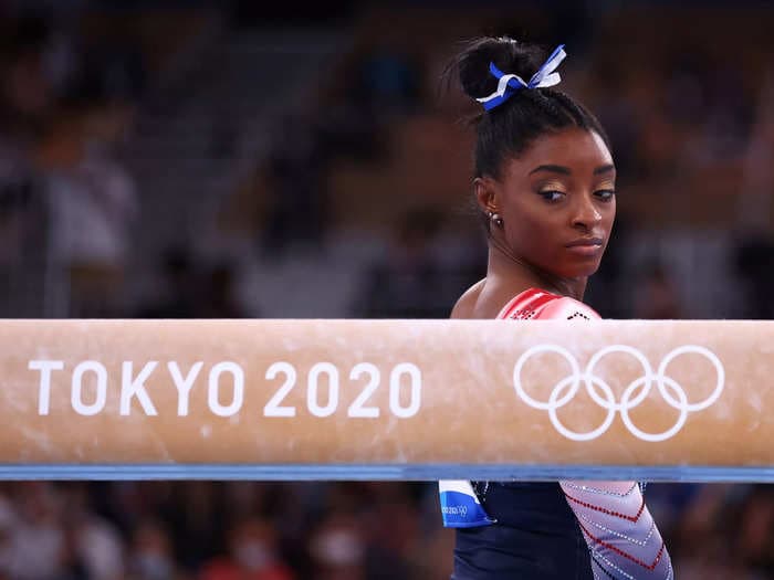 Simone Biles clapped back at her Tokyo Olympics critics and said 'the word quitter is not in my vocabulary'