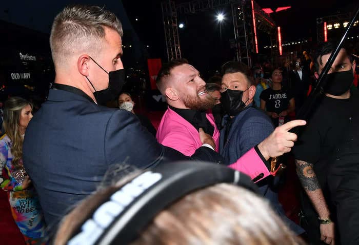 Conor McGregor threw a drink at Machine Gun Kelly on the VMAs red carpet, then called him a 'little vanilla boy'