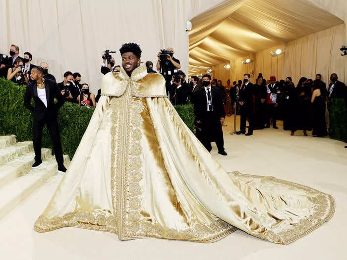 Lil Nas X made an entrance at the Met Gala with 3 show-stopping outfits including golden body armor