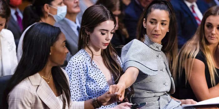Touching photo shows Aly Raisman supporting Simone Biles as US gymnasts deliver harrowing testimony about the FBI investigation into Larry Nassar