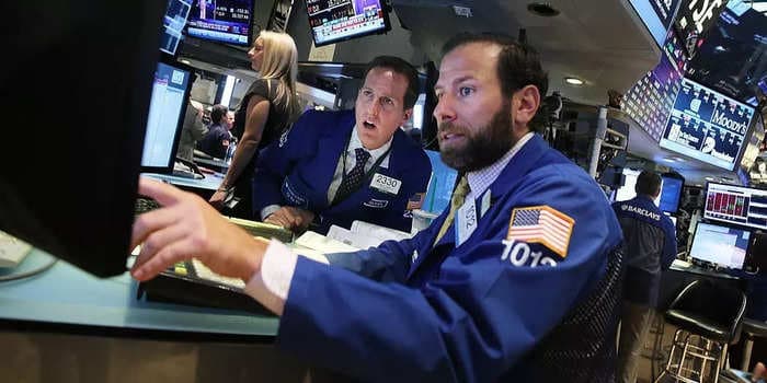 Dow surges 338 points as Federal Reserve hints at pace of tapering and timing of rate hikes