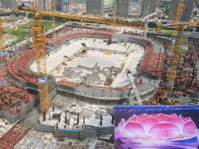 Beleaguered real-estate giant Evergrande's $1.8 billion lotus-shaped soccer stadium is partially built and in shambles amid the company's impending collapse