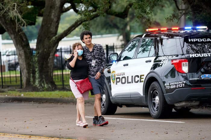 A former student was arrested after firing a rifle through the locked door of a Texas school, shooting the principal