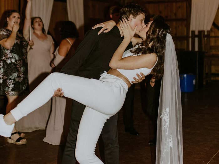 A couple who changed into sweatsuits at their wedding reception say they have zero regrets about ending their special day 'super comfy'