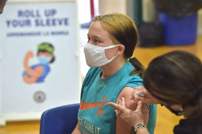 A Florida school says vaccinated students must stay home for 30 days after each shot, citing a false claim that they'll infect others