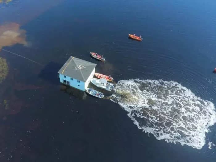 Incredible video shows how a Canadian couple lifted and floated an entire home across a half-mile waterway to move it to a more ideal address