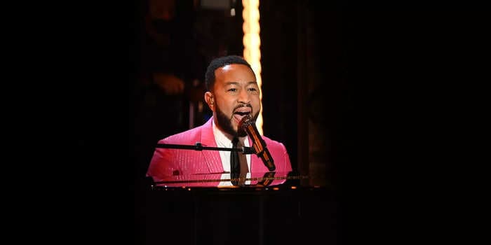 A street artist was performing John Legend's 'All of Me' when the singer-songwriter showed up in the crowd