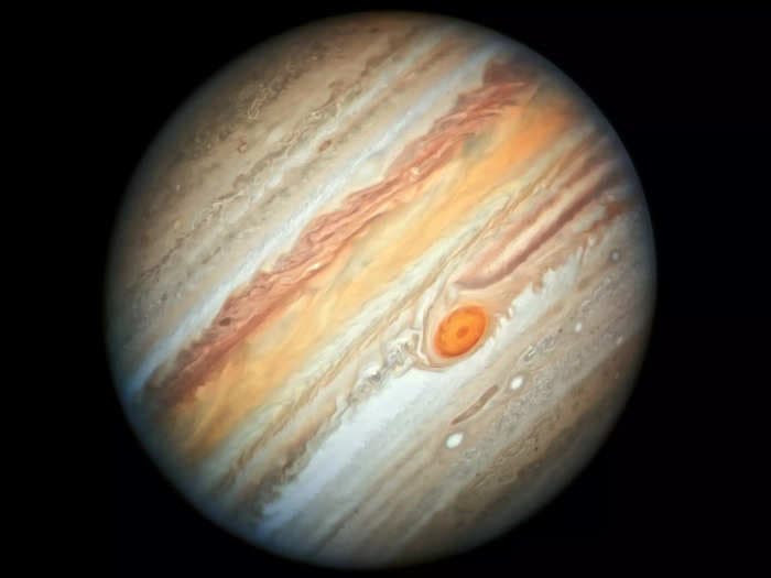 NASA's Juno spacecraft flew above Jupiter's Great Red Spot and discovered that the vortex churns up to 310 miles deep