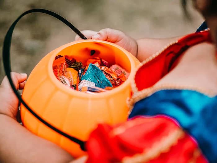 A Texas woman pointed a loaded gun at a 7-year-old child trick-or-treating outside her house, sheriffs say