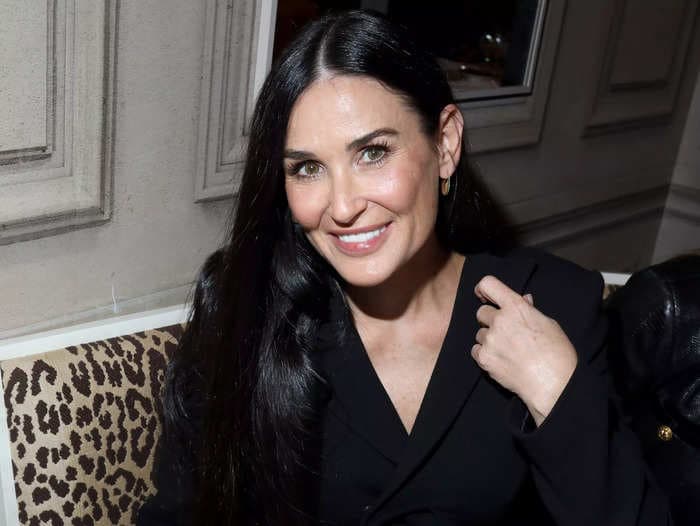 Demi Moore pulled off the no-shirt trend in a daring velvet pantsuit