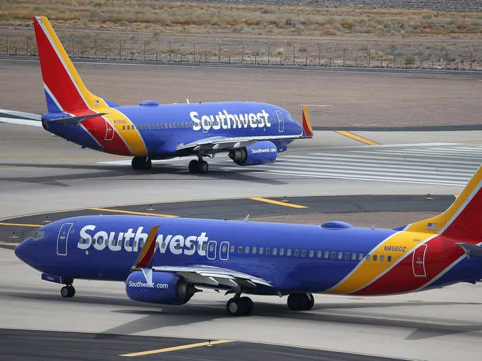 Southwest Airlines is asking corporate employees to work customer service roles at airports amid staffing shortages over the holiday