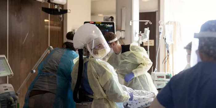 Travel nurses say the current healthcare system is 'unsustainable' as COVID-19 infections surge again. Some say the pay is the only thing keeping them on the front lines.