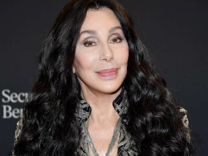 Cher says she refuses to let her hair go completely gray but doesn't judge women who do